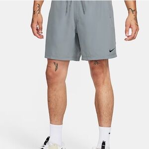Nike Men's Light Gray Athletic Shorts .  Features zippered pockets as well